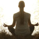 Free woman doing yoga pose